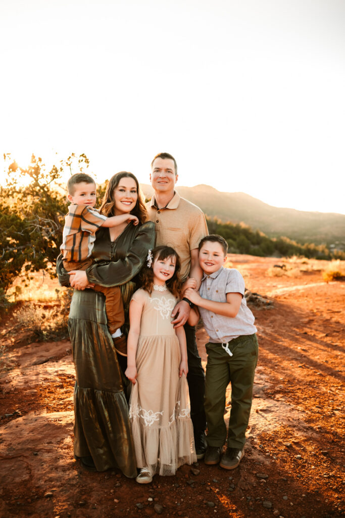 Family in sedona red rocks in maxi dresses at sunset by annie bee photography.