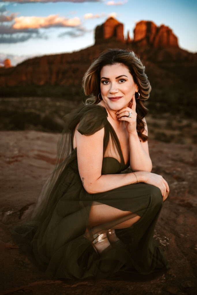 Women in a dress in front of cathedral rock in sedona.