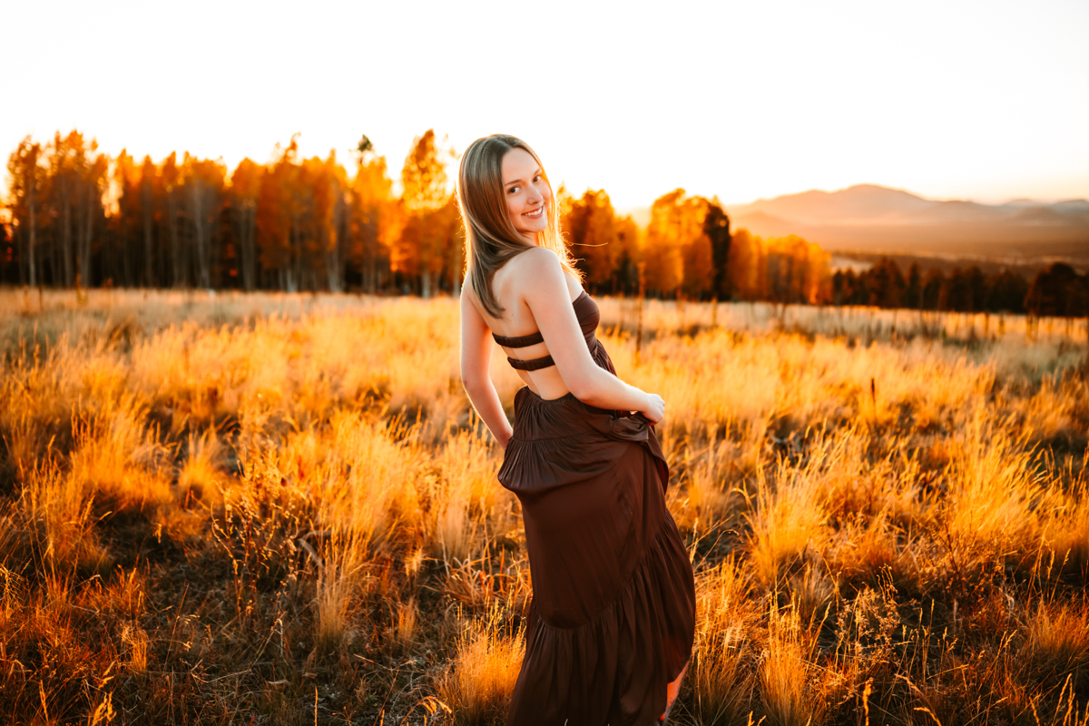 Arizona snowbowl at sunset with girl swaying her dress by annie bee photography.