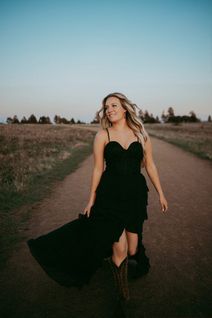 Senior girl walking through buffalo park in flagstaff.