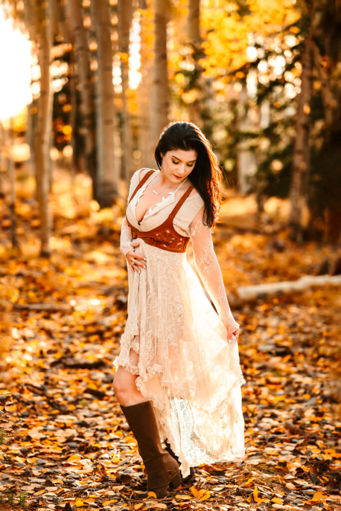 Women in a joyfolie flowy dress in the fall colors of flagstaff.