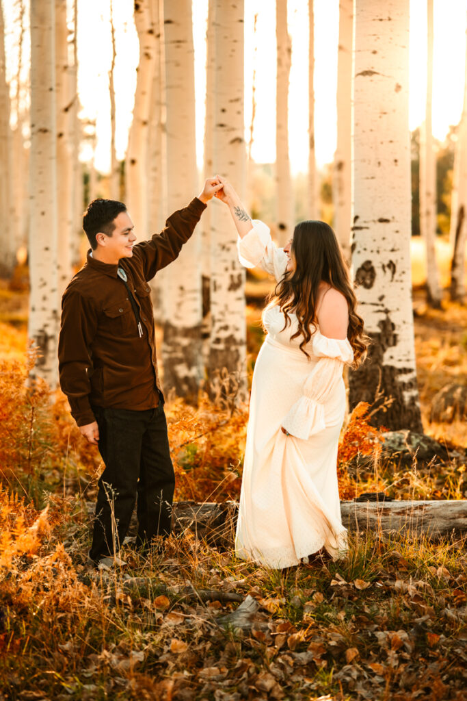 Girl in baltic born maxi dress dancing in the aspens of Flagstaff with her husband by annie bee photography.