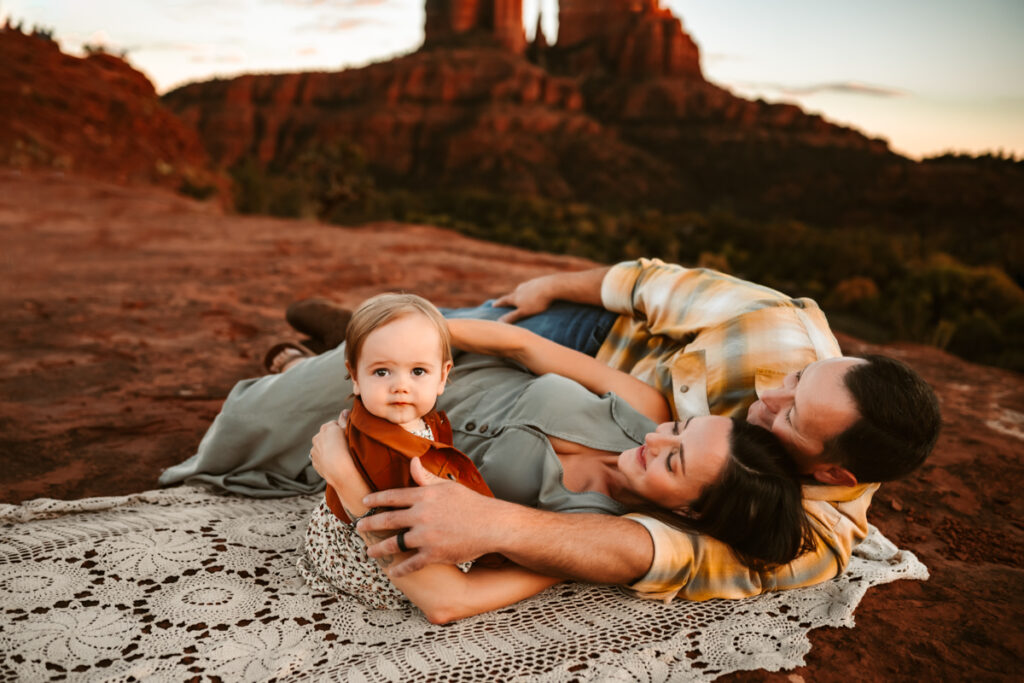 Family laying in the red rocks of sedona.