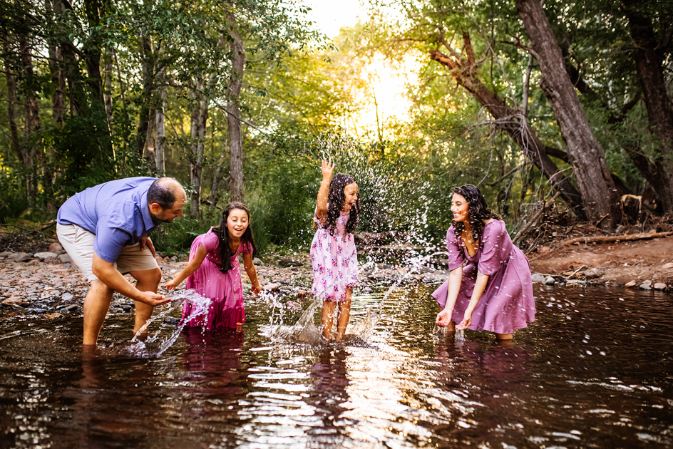 Kids splashing in Oak Creek Canyon at Crescant Moon Picnic area in Sedona by Annie Bee Photo.