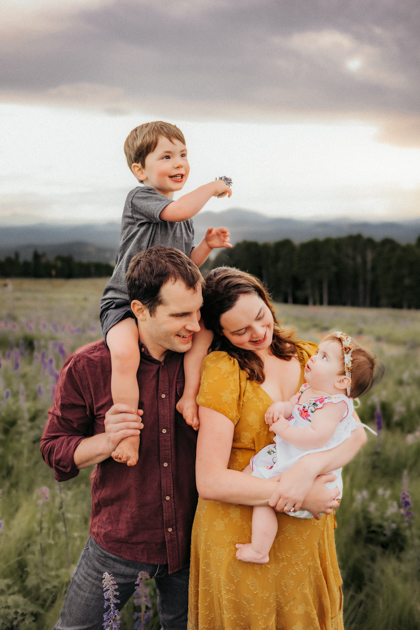 Family playing in the wildflowers on Arizona Snowbowl in Flagstaff by Annie Bee Photography.