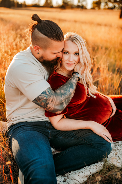 Beautiful expecting mother in a red velvet gown in Flagstaff, AZ.