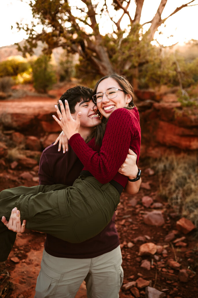 Newly engaged girl showing off her wedding ring at Bell Rock in Sedona.