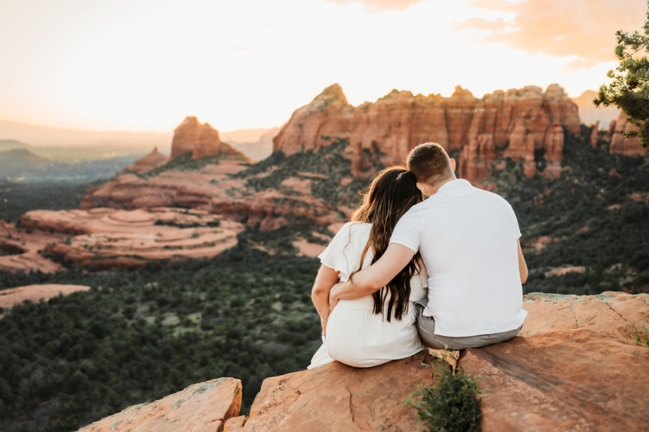 Couple enjoying the sunset at Merry-Go-Round-Rock in Sedona by Annie Bee Photography.