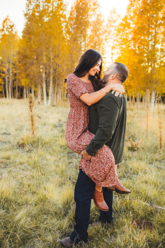 Couple hugging in the aspen trees at the San Francisco peaks.