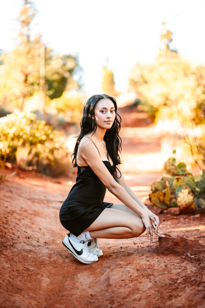 NAU graduate posing in Sedona by Annie Bee photography