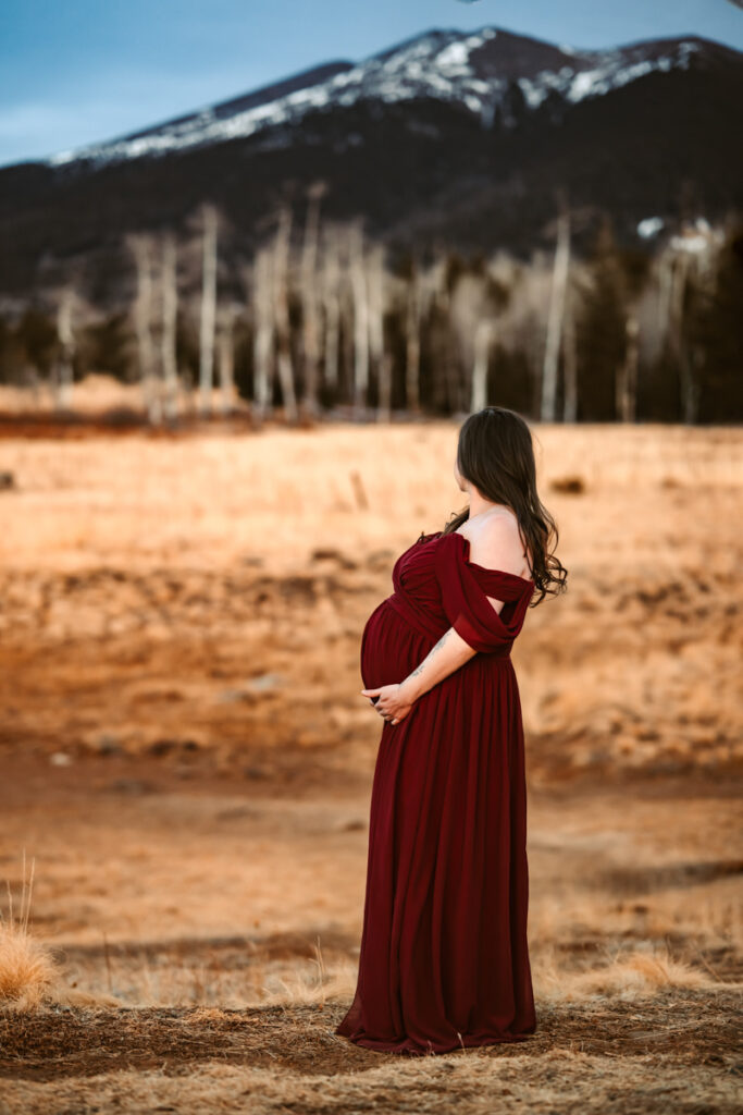 Arizona Snowbowl maternity session with women in red dress