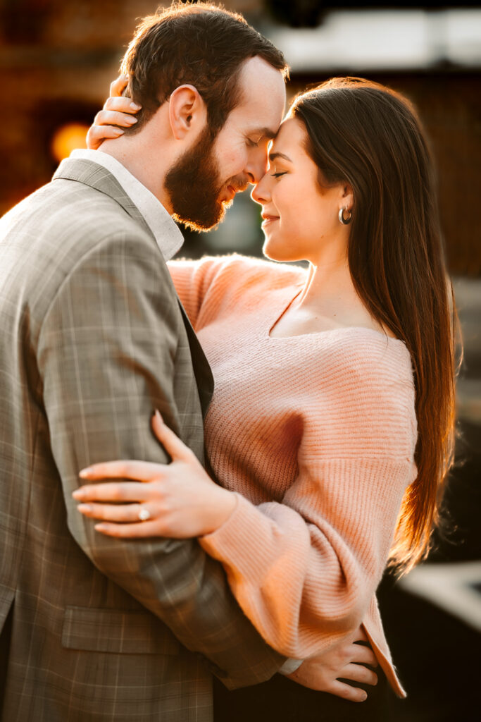 Newly engaged couple hugging in downtown flagstaff.