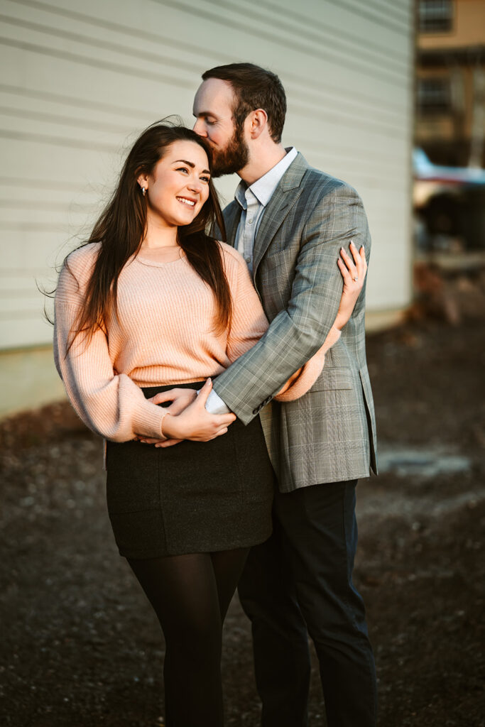 Engaged couple in downtown Flagstaff looking at the sunset in Arizona.