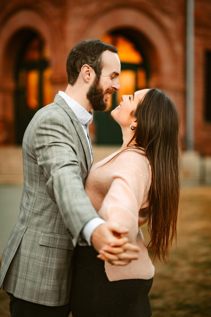 Engaged couple holding hands outside of the Flagstaff courthouse in Arizona.