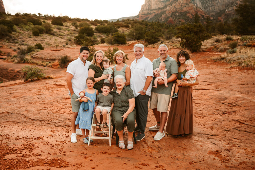 Extended family with great grandma in the red rocks of Sedona at sunrise.