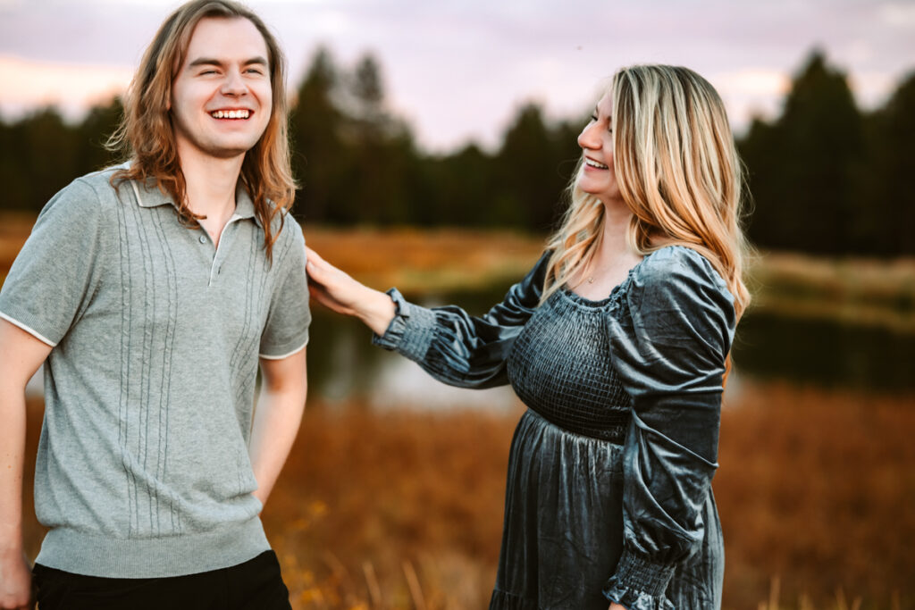 Mother and son laughing at kachina wetlands with a pond by annie bee photography at the best Flagstaff photo locations.