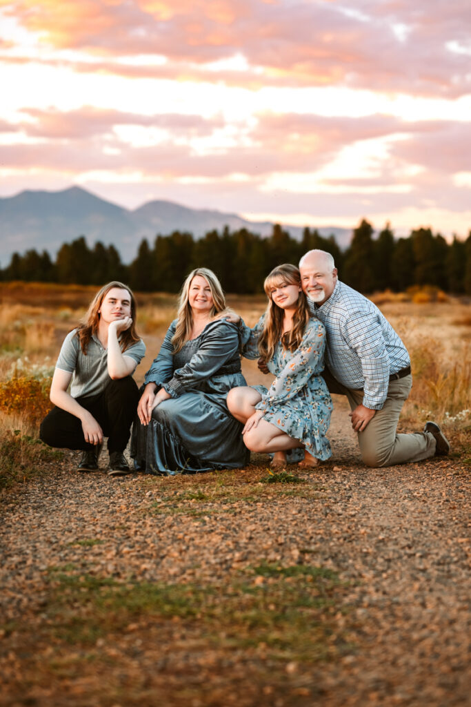 Family in front of snowbowl on a trail in flagstaff by annie bee photography.