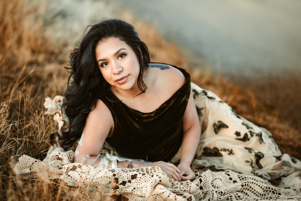 Woman laying in the grass at buffalo park by annie bee photography.