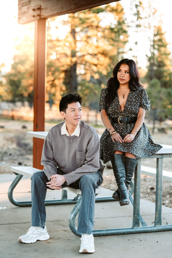 flagstaff hairstylist sitting on a picnic bench by annie bee photography.